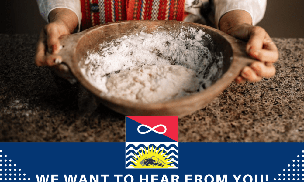 A wooden bowl with a loose dough & flour is held on either side by someone's hands. 