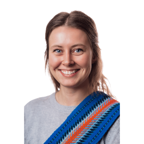 Headshot of a smiling young woman with a Metis sash over her shoulder.