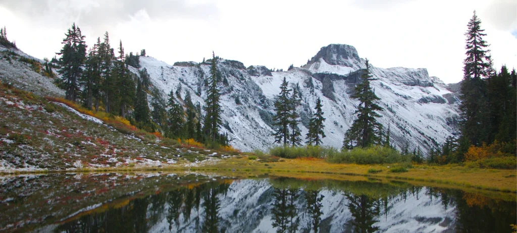 A lake with mountains in the background.